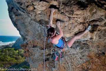 Seaside sport climbing on overhanging limestone caves